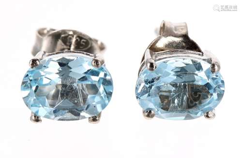 Pair of blue topaz oval ear studs in silver, 8mm x 6mm