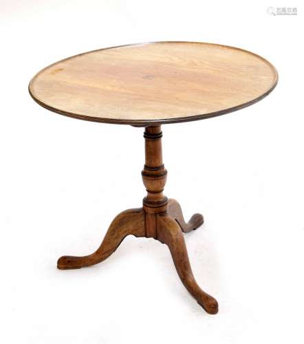 George III mahogany circular tripod table, the moulded dish tilt-top upon a barrel turned column