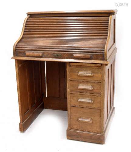 Early 20th century oak roll top single pedestal desk, 35.5