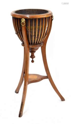 Edwardian inlaid mahogany jardiniere, brass lion head mounts to the bowl, on swept tripod support