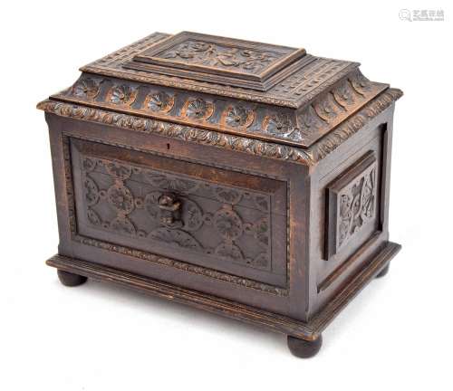 Victorian carved oak cellarette/wine cooler, the hinged cover with figural panel within multiple