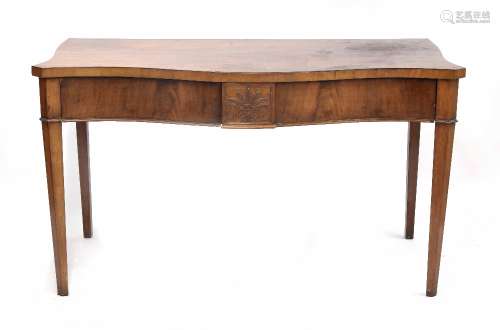 Early 19th century serpentine mahogany serving table, the plain top over two drawer frieze with