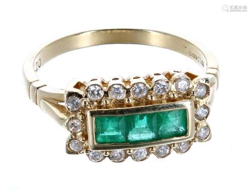 18ct emerald and diamond oblong cluster ring, with three princess-cut emeralds in a surround of