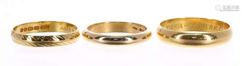 Two 22ct wedding band rings, 7.4gm; also an 18ct wedding band ring, 4.8gm, the largest 4.5mm wide (