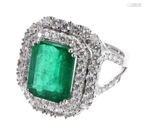 Impressive and large 18ct white gold emerald and diamond double halo ring with diamond set