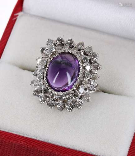 18ct white gold amethyst and diamond cluster ring, with a central amethyst cabouchon in a surround