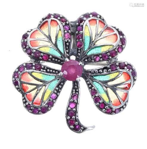 Silver enamel brooch in the form of a four leaf clover set with a central ruby and ruby outer leaves