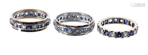 Three 9ct gem set full eternity rings, 10.9gm in total (3)