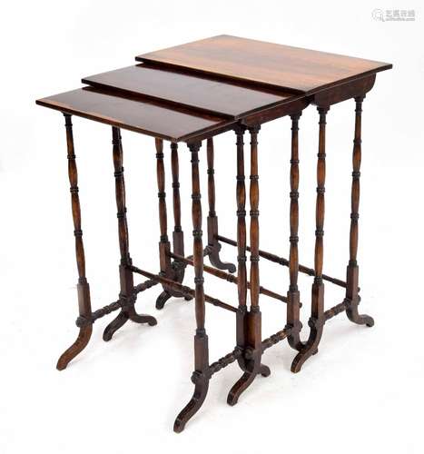 Nest of three Regency rosewood recatangle occasional tables, raised on slender turned supports