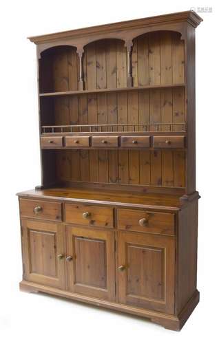 Stained pine dresser, the galleried shelf raised back over base section of three short drawers