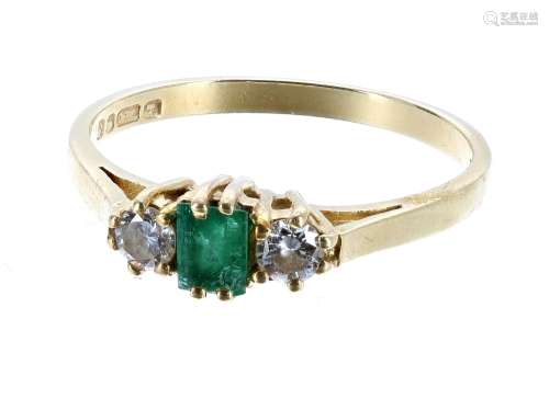 18ct yellow gold emerald and diamond three stone ring, the emerald 0.20ct flanked with round