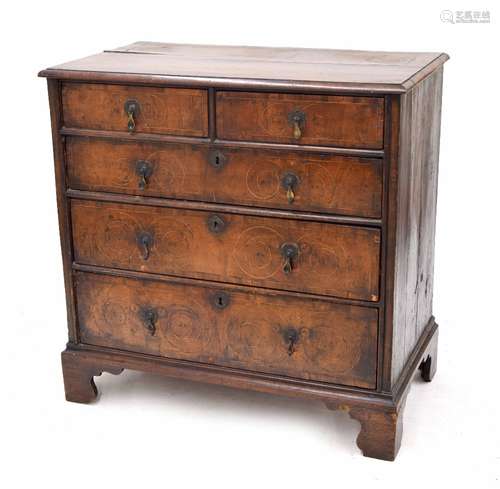 Early 18th century walnut inlaid chest of drawers, the quarter veneered moulded top over two short