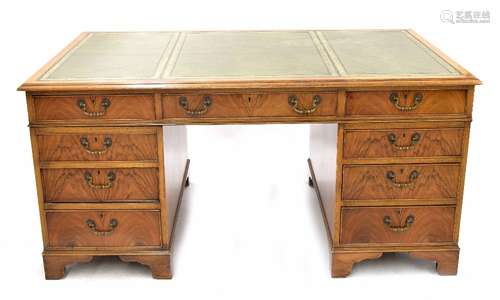 Reproduction walnut twin pedestal desk, the moulded top with inset green tooled leather writing