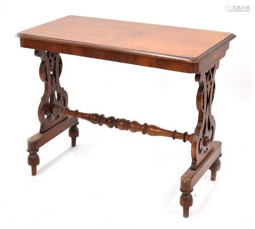 Victorian mahogany stretcher table, the rectangular moulded top raised on scrolling carved