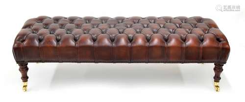 Good leather button upholstered hearth stool/window seat, raised on turned supports terminating in