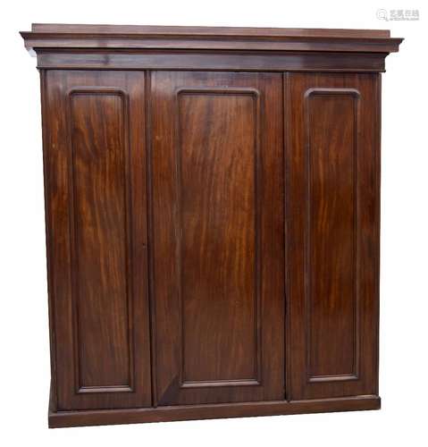 Victorian mahogany triple panelled robe, the stepped moulded cornice over three panelled doors,