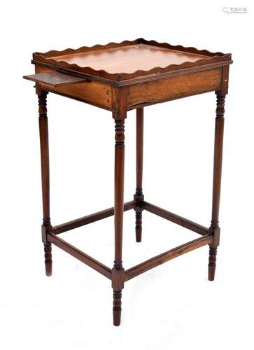 Regency style mahogany tray top night table, the wavy rim gallery over two pull-out candle slides to