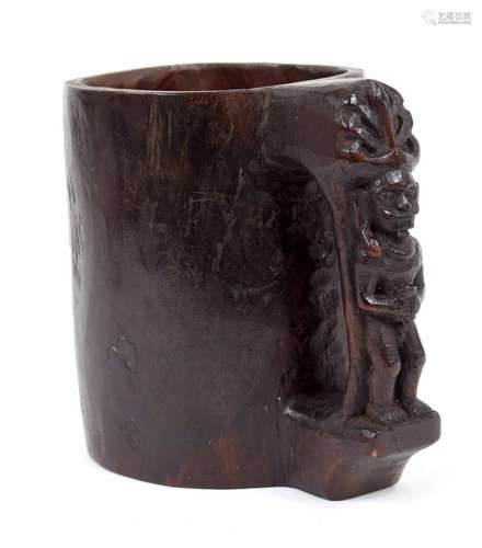 Indonesian (Nias Islands) carved wooden grain measure/cup, featuring ancestor figural handle of