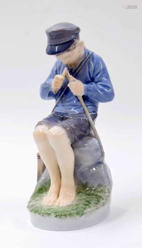 Royal Copenhagen - figure of a seated shepherd boy whittling a stick, factory stamp and inscribed '