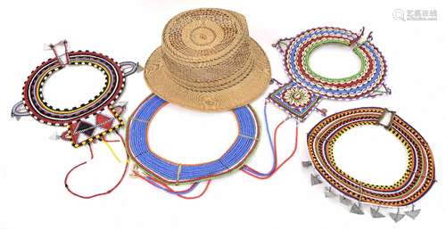 Collection of four African beaded and shell mount wide necklaces; also a woven trilby hat (5)