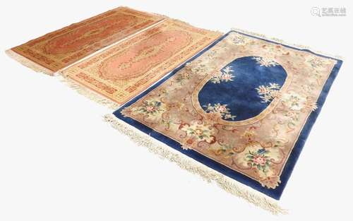 Pair of Belgian Super Keshan woollen rugs, on a pink ground, 70'' x 35''; together with a further