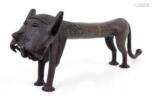 20th century Nigerian Benin style bronze leopard figure, with stylised face and curling mane, the