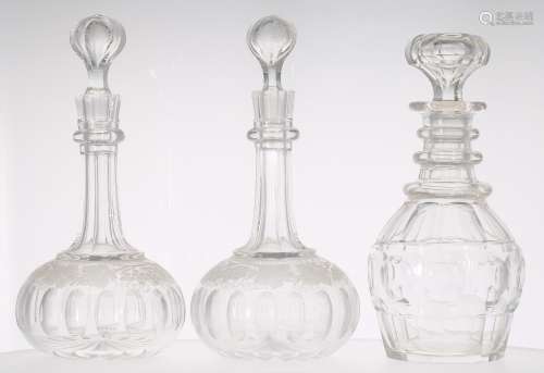 Pair of glass decanters and stoppers, with faceted slim neck over a fruiting vine etched border over