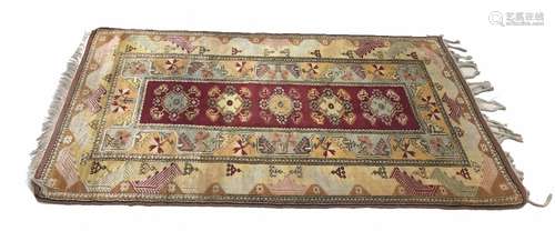 Persian pattered natural ground rug, decorated with central five floral medallion panel within