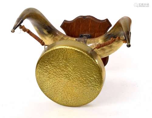 Brass dinner gong, hanging on horn supports with mahogany shield wall mount; together with a commode