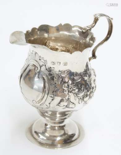 George III silver cream jug with a card cut rim, on a pedestal base, maker NS & AN, London 1768,