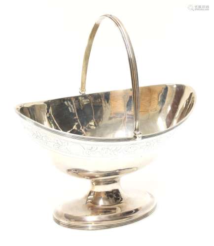 George III silver boat shape bonbon dish, swing handle and foliate engraved border on a pedestal