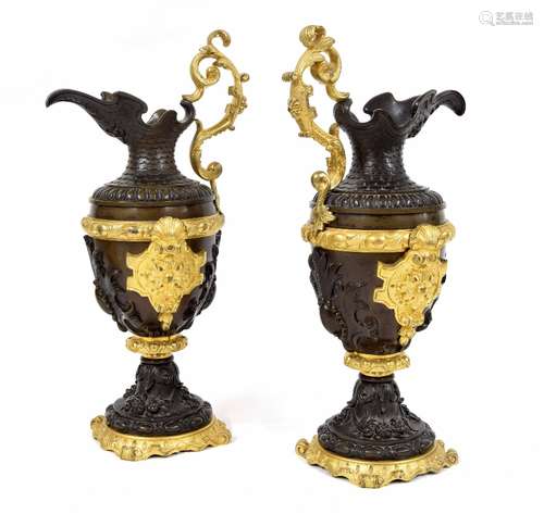 Good pair of French classical style gilt and patinated bronze ewers, 12