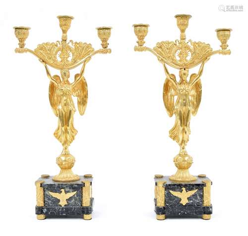 Good pair of Regency Empire ormolu and marble figural candelabra, modelled as angels holding three