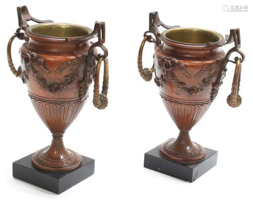 Pair of Classical style French bronze urns, with twin handles, brass liners, cast with floral