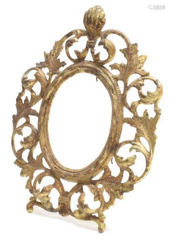 Gilt metal pierced scrolling strut picture frame, oval aperture 5.5