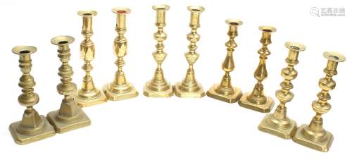 Five pairs of Victorian brass candlesticks, the tallest 9