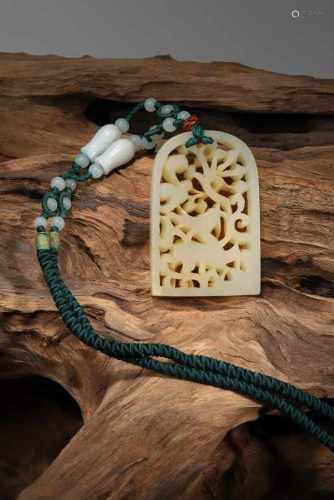 A CHINESE JADE PENDANT CARVED QI LIN