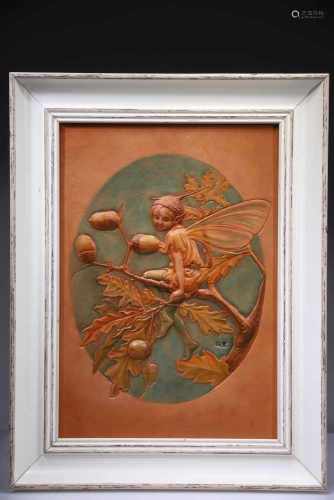 A FRAMED LEATHER CARVING