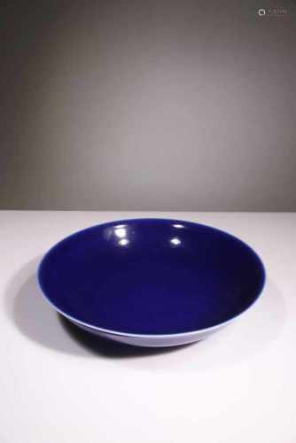 A BLUE-GLAZED BOWL WITH A FLARED MOUTH