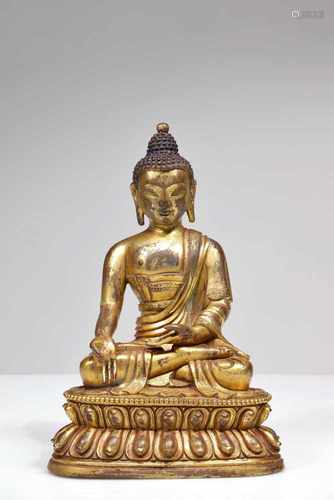 A BRONZE GILDED BUDDHA