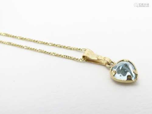 A 9ct gold heart-shaped pendant on fine-link chain, the pendant set with single heart-shaped