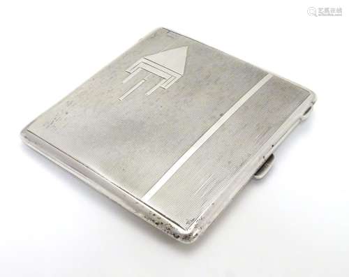 An Art Deco silver compact with engine turned decoration. Hallmarked Birmingham 1932 maker Charles S