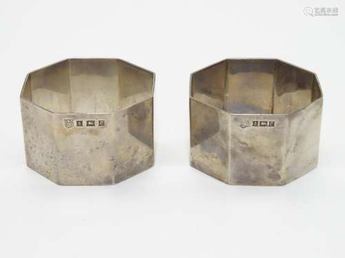 A pair of silver napkin rings of octagonal form. Hallmarked Birmingham 1954 maker Barker Brothers