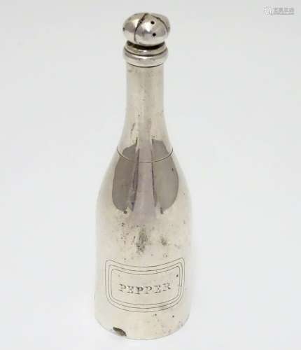 An novelty white metal pepper pot formed as a bottle and titled ' pepper'. 5