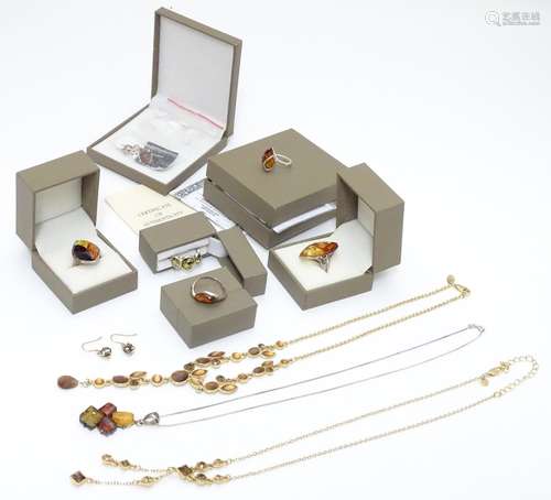 Assorted silver and white metal amber jewellery to includes, rings, pendants, earrings etc. Please