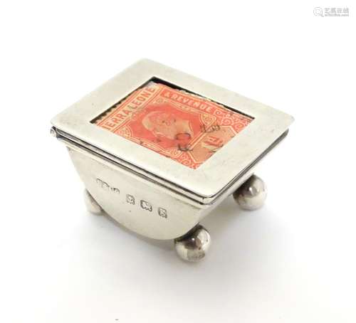 A small silver stamp box with stamp to lid. Hallmarked Birmingham 1906 maker Sydney & Co. 1 1/2