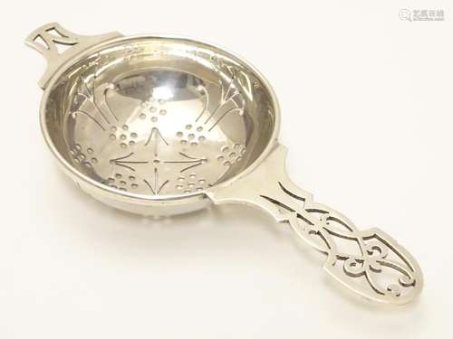 A silver tea strainer hallmarked Sheffield 1965 maker HH. 5