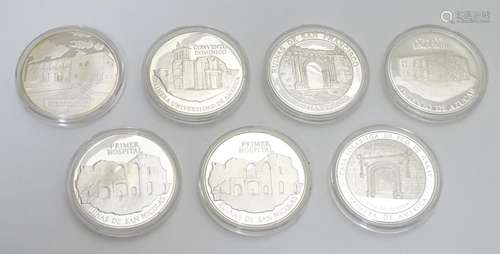 Dominican republic : Seven assorted white metal medallion coins depicting various landmarks /