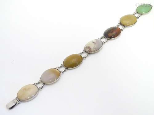 A Continental . 800 silver bracelet set with various agate hardstone cabochon. Approx 7