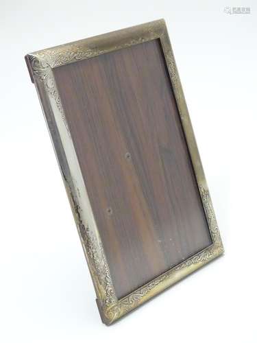 A photograph frame with silver surround. Hallmarked Birmingham 1985 maker James Brothers 6 3/4